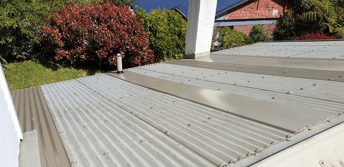 Repairs in a leaking metal roof. 